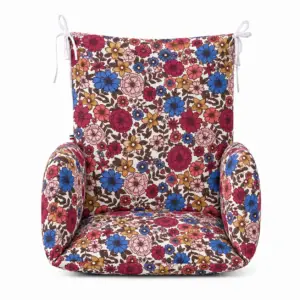 Coussin de chaise haute universel vu de face, à fleurs bleues, bordeaux, roses et ocre sur fond clair.