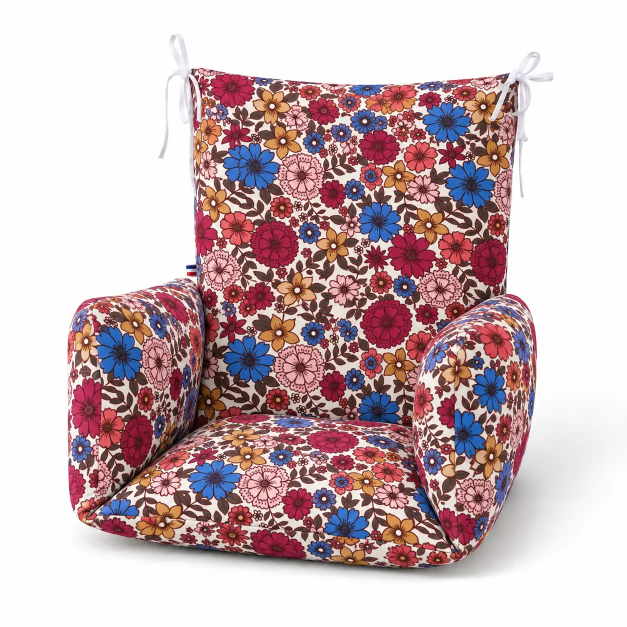 coussin universel chaise haute - Modèle Louison 2 Coussin de chaise haute universel à fleurs multicolores vu de trois quarts, avec assise et accoudoirs rembourrés.