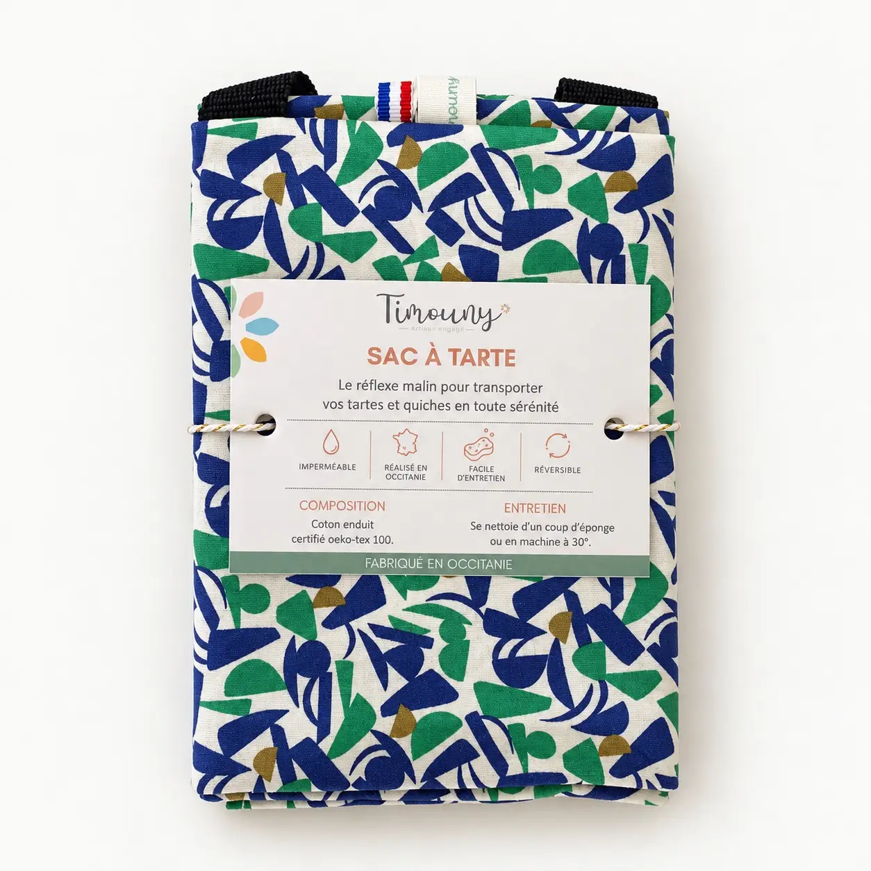 Sac à tarte imperméable Matisse – Coton enduit réversible, fabriqué en France 1 Sac à tarte Timouny plié, avec son emballage, motif bleu et vert